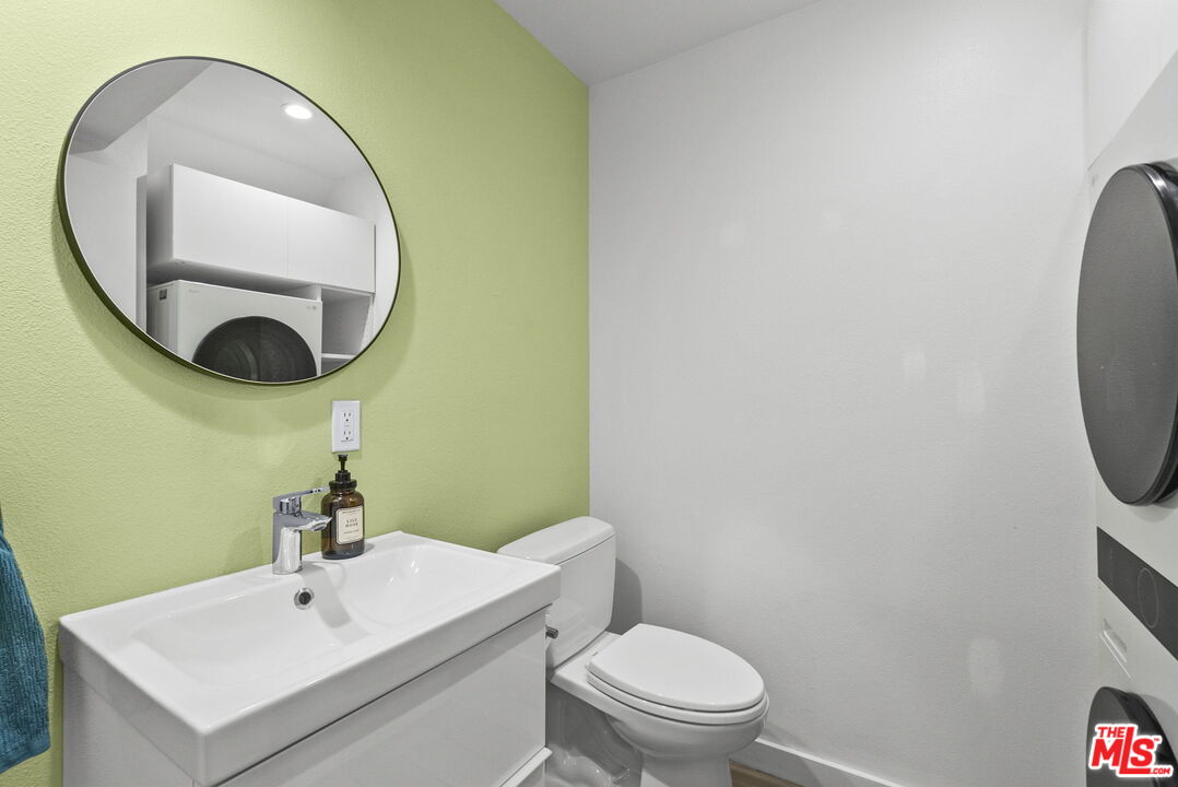 1802 20th Street, Unit B Santa Monica, CA 90404 - Photo 11 of 22 a bathroom with a sink mirror and toilet