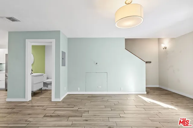 a bathroom with a sink mirror and toilet