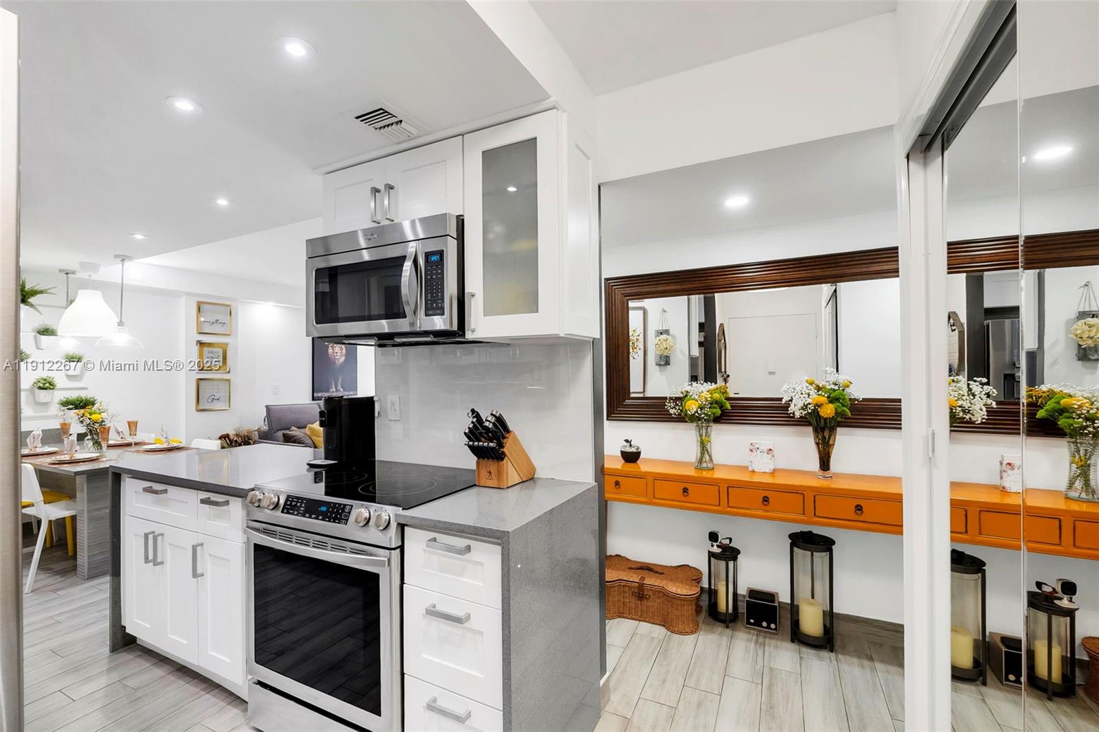 2121 North Ocean Boulevard, Unit 204W Boca Raton, FL 33431 - Photo 13 of 59 a kitchen with stainless steel appliances granite countertop a sink and cabinets
