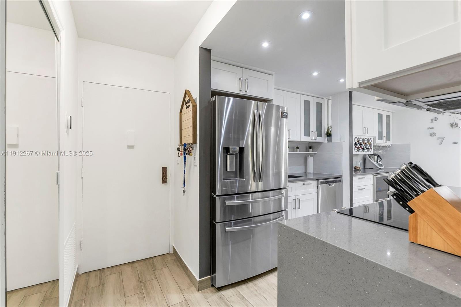 2121 North Ocean Boulevard, Unit 204W Boca Raton, FL 33431 - Photo 14 of 59 a metallic refrigerator freezer sitting in a kitchen