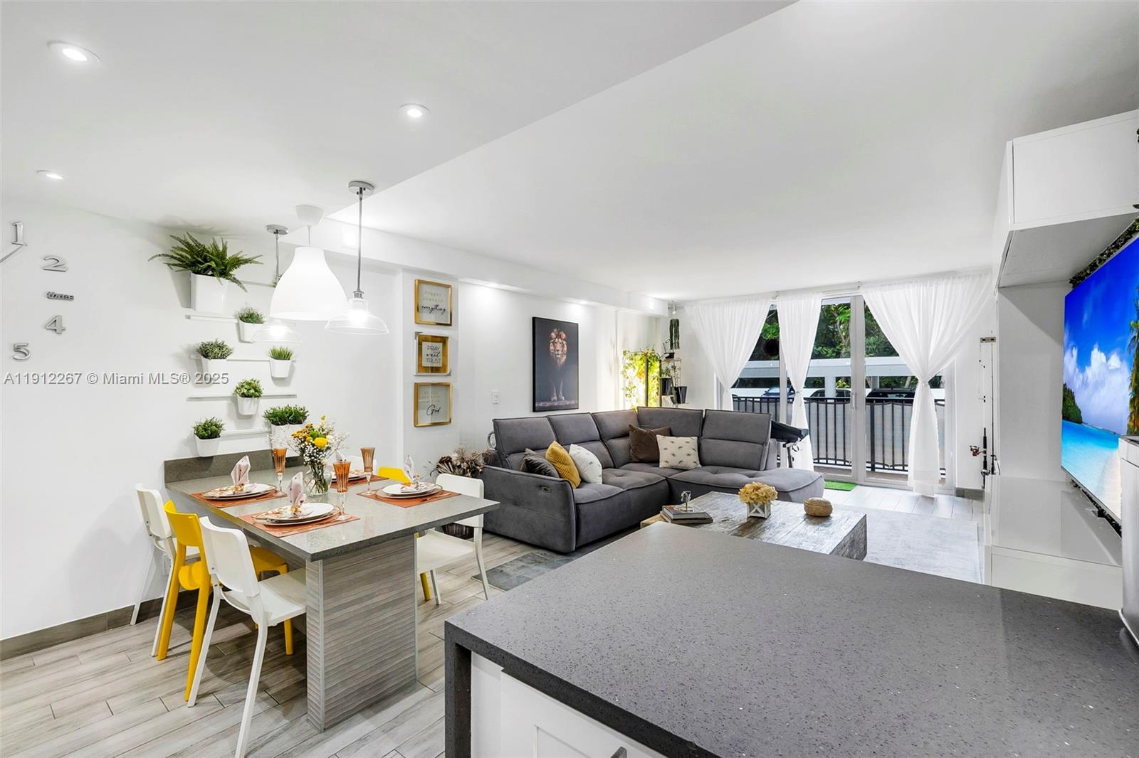 2121 North Ocean Boulevard, Unit 204W Boca Raton, FL 33431 - Photo 16 of 59 a living room with furniture and a wooden floor
