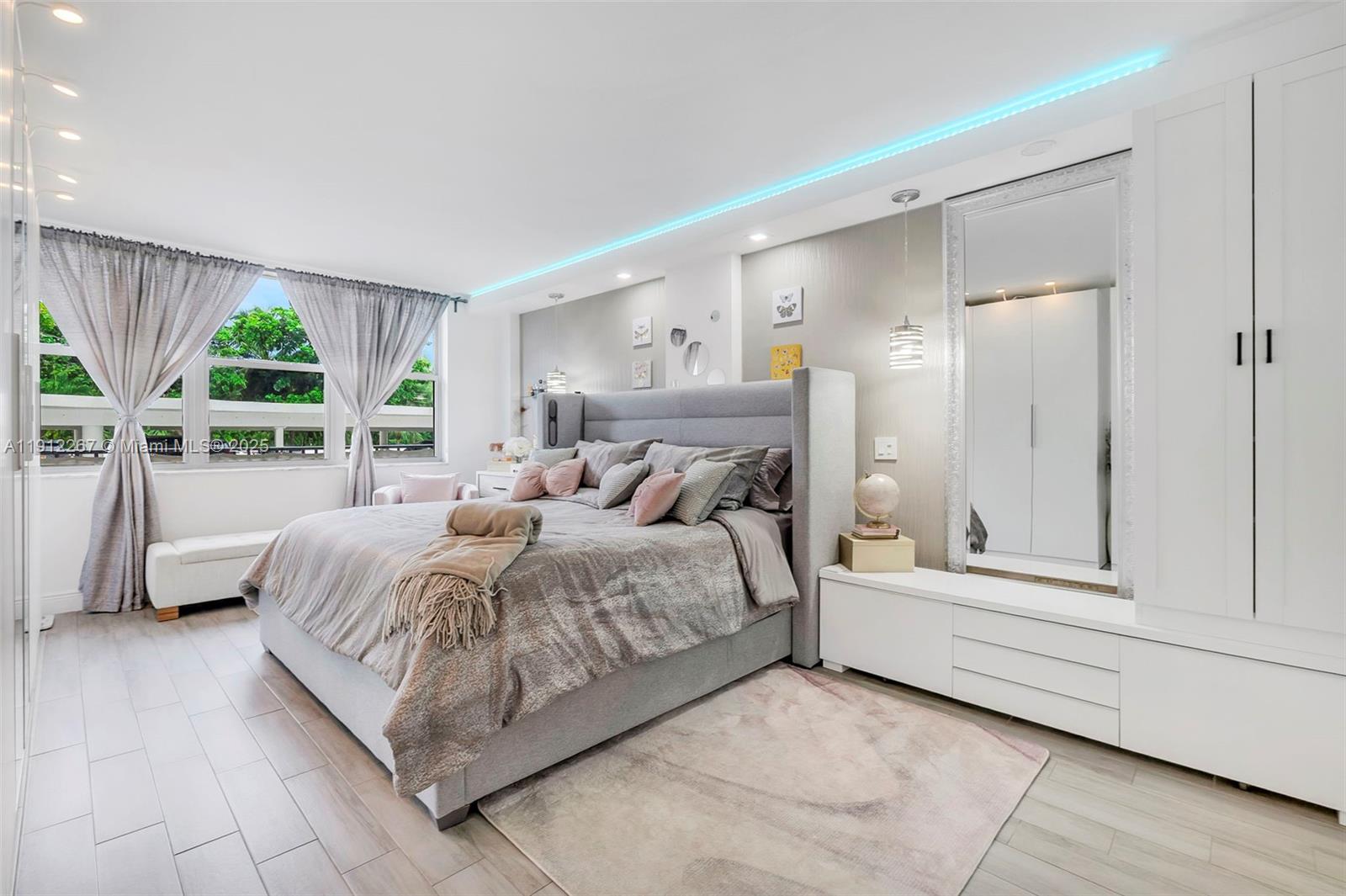 2121 North Ocean Boulevard, Unit 204W Boca Raton, FL 33431 - Photo 17 of 59 a spacious bedroom with a bed and large window