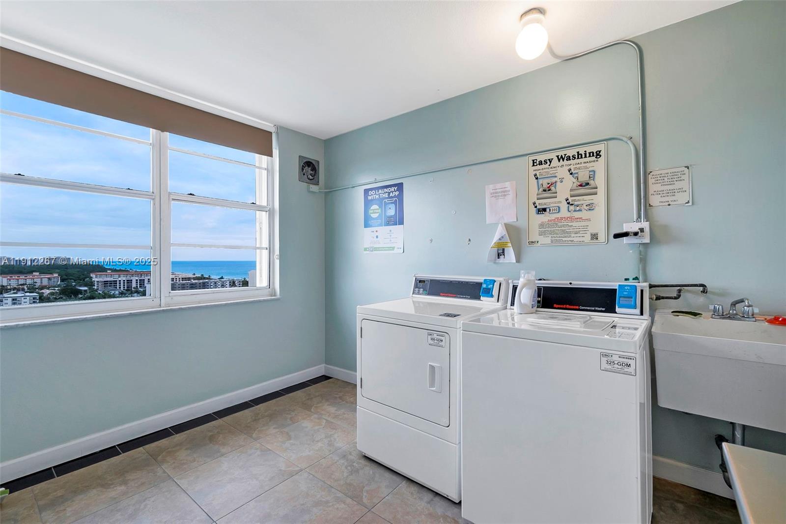 2121 North Ocean Boulevard, Unit 204W Boca Raton, FL 33431 - Photo 27 of 59 a utility room with dryer and washer