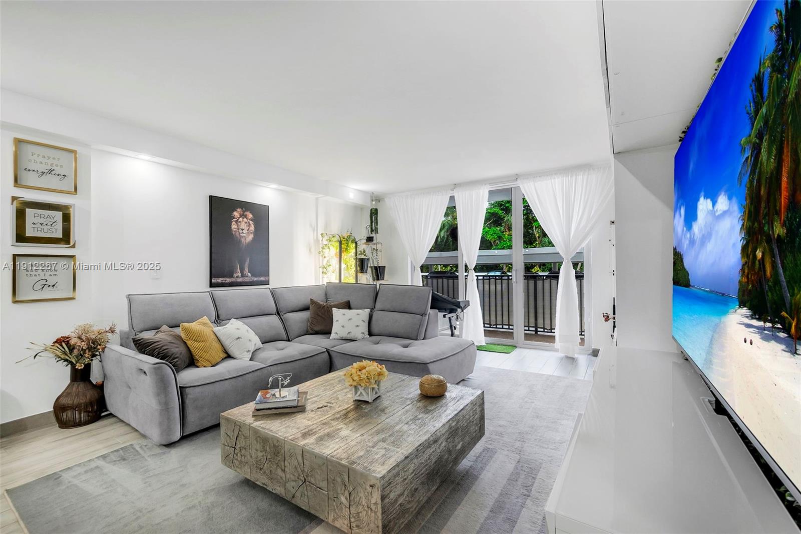 2121 North Ocean Boulevard, Unit 204W Boca Raton, FL 33431 - Photo 3 of 59 a living room with furniture fireplace and a large window