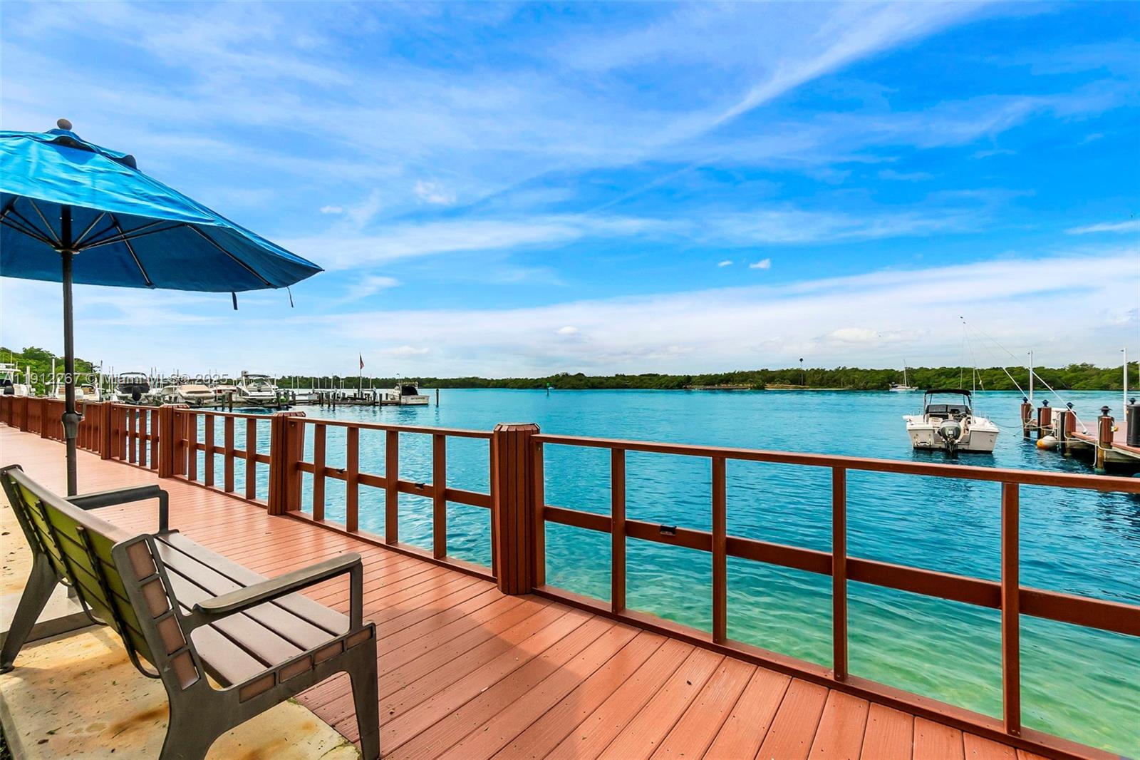 2121 North Ocean Boulevard, Unit 204W Boca Raton, FL 33431 - Photo 34 of 59 a view of a balcony with wooden chairs and floor