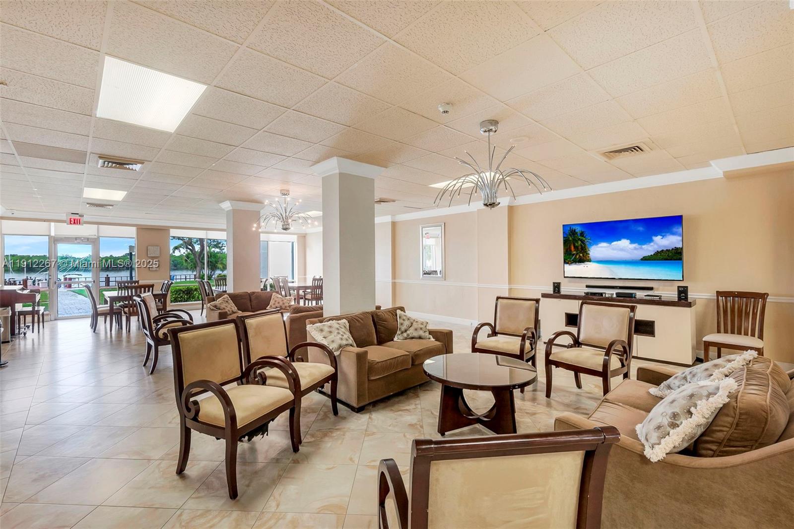 2121 North Ocean Boulevard, Unit 204W Boca Raton, FL 33431 - Photo 36 of 59 a living room with furniture and a flat screen tv