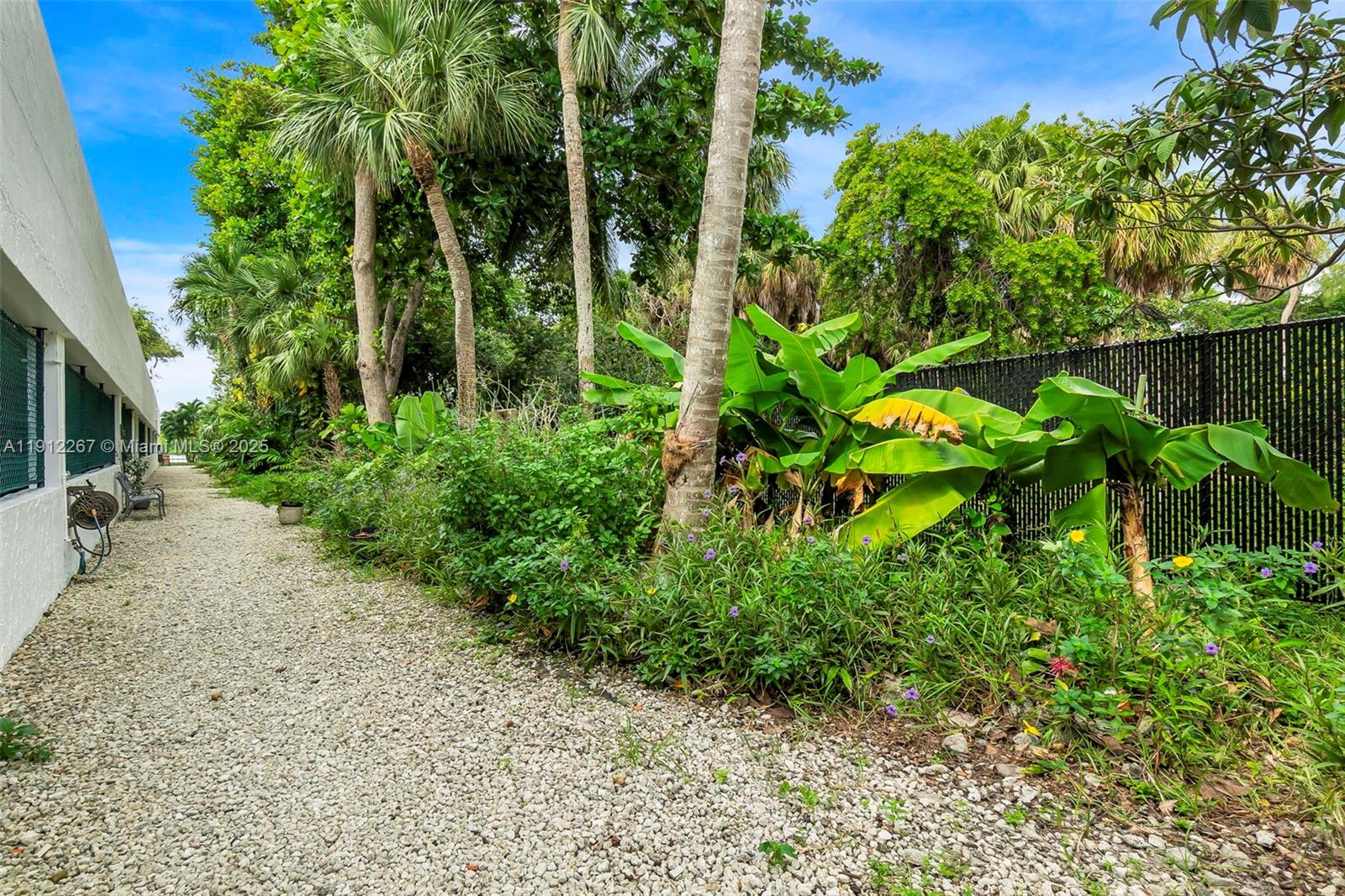 2121 North Ocean Boulevard, Unit 204W Boca Raton, FL 33431 - Photo 46 of 59 a backyard of a house with lots of green space