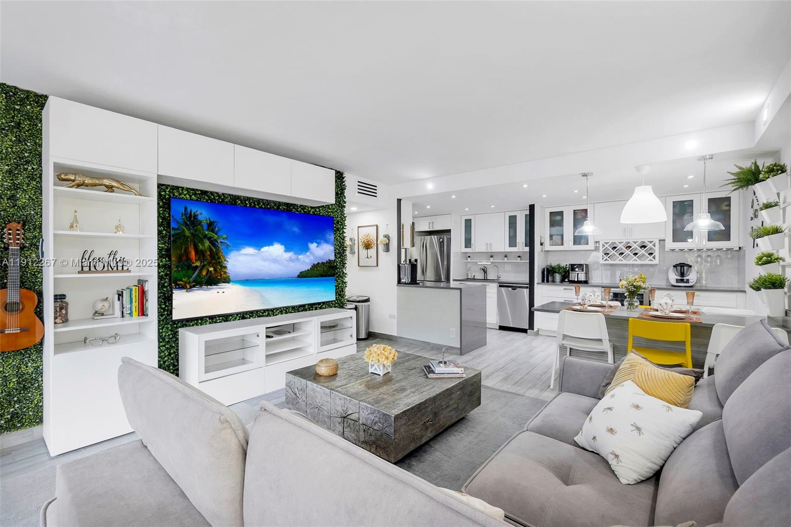 2121 North Ocean Boulevard, Unit 204W Boca Raton, FL 33431 - Photo 6 of 59 a living room with furniture and a flat screen tv