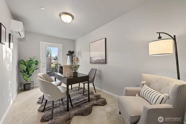 a kitchen with stainless steel appliances granite countertop a stove a refrigerator a sink a dining table and chairs with wooden floor