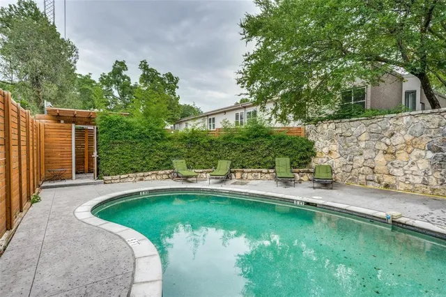 a view of a patio with swimming pool