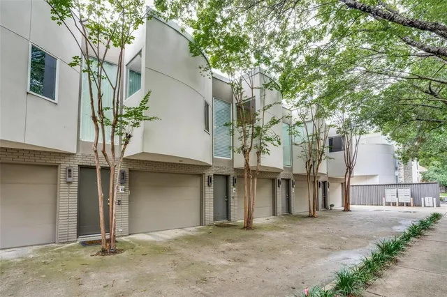 a view of a house with a tree