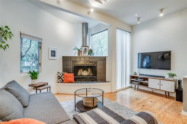 a bedroom with furniture and a fireplace