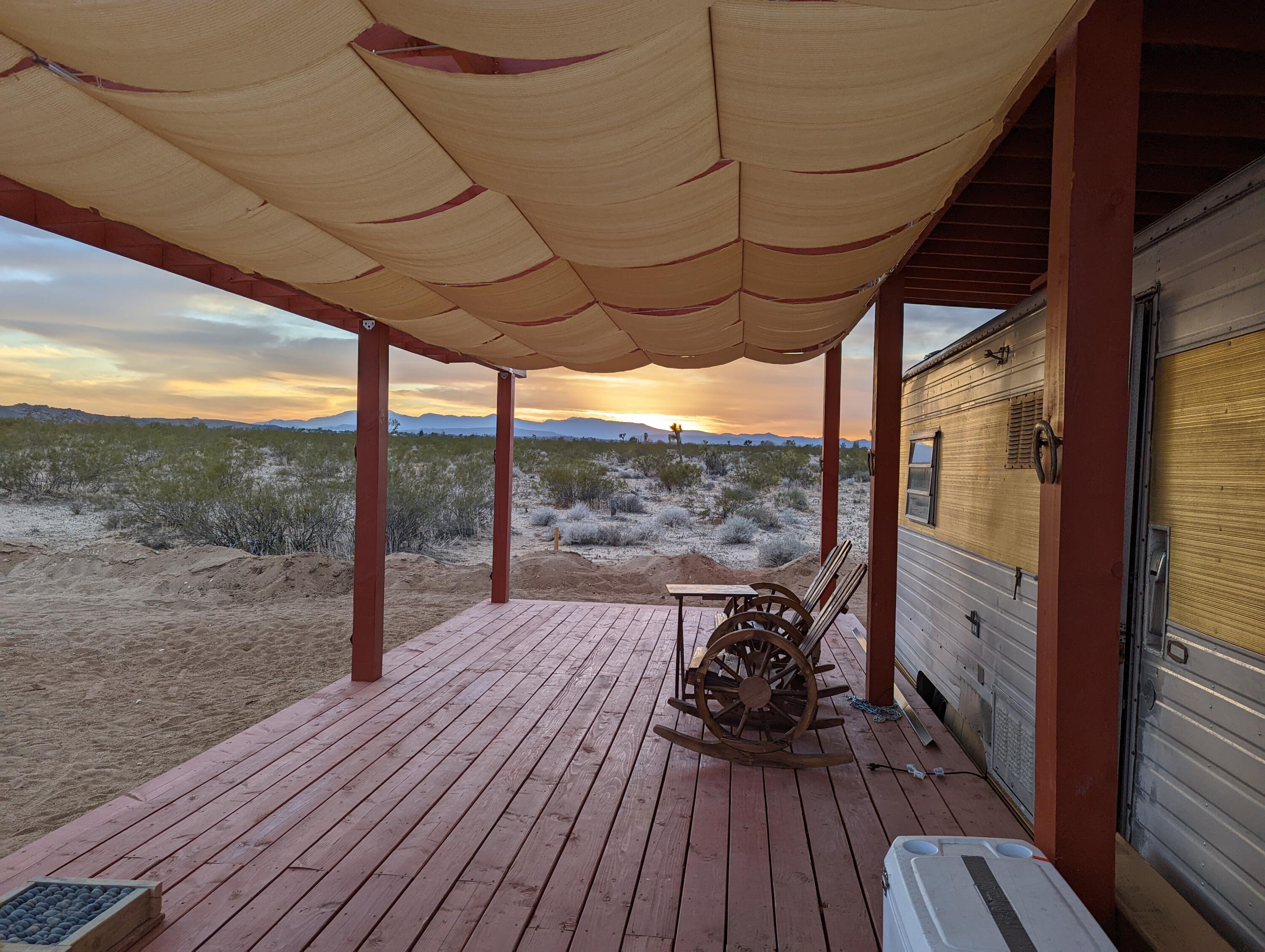 60876 Campanula Street Joshua Tree, CA 92252 - Photo 11 of 29 a view of porch with wooden floor
