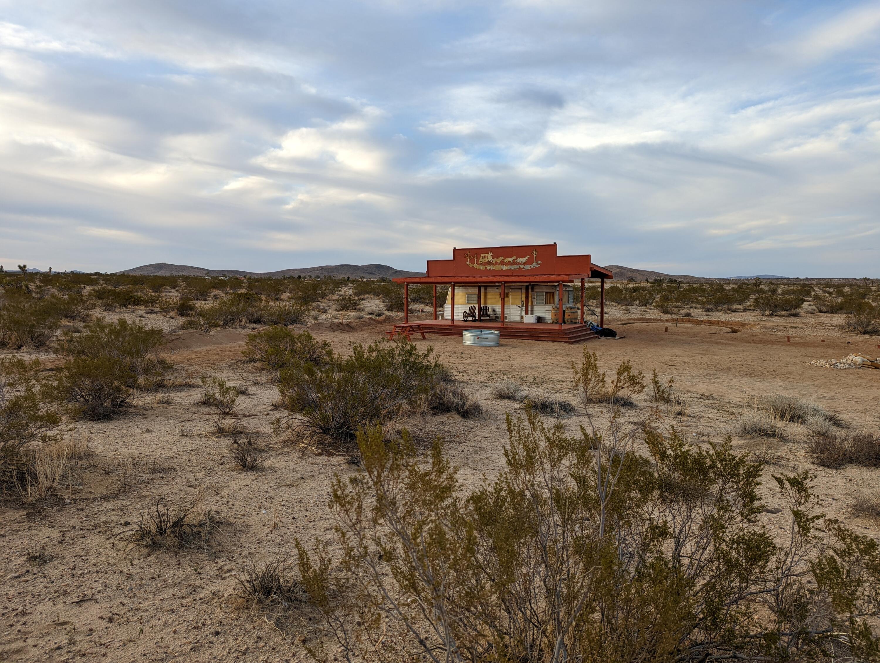 60876 Campanula Street Joshua Tree, CA 92252 - Photo 21 of 29 a view of a lake with houses in the back