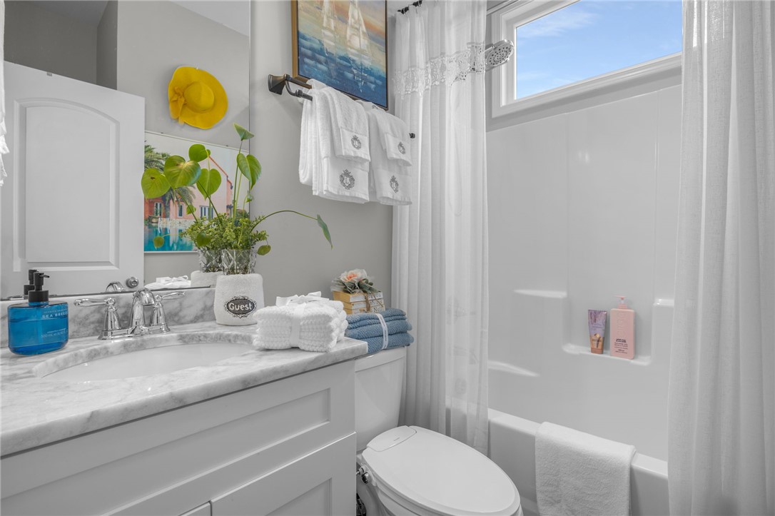 28 Vanessa Rae Lane Pendleton, SC 29670 - Photo 10 of 16 This bright bathroom features a spacious tub and a classic marble vanity, creating a refreshing atmosphere.