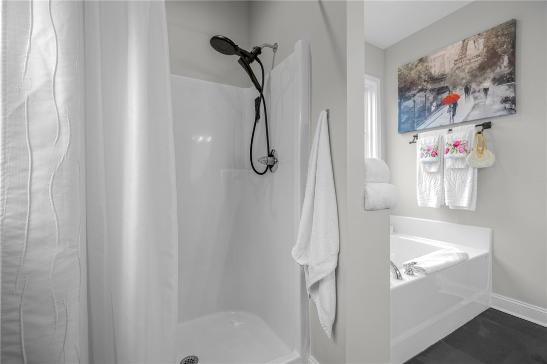 28 Vanessa Rae Lane Pendleton, SC 29670 - Photo 8 of 16 This clean bathroom features a shower and a soaking tub, offering a refreshing retreat.