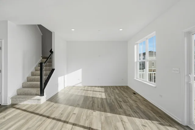 a view of an empty room with stairs