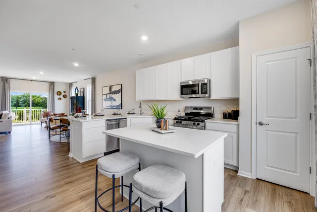 a kitchen with a table and chairs in it