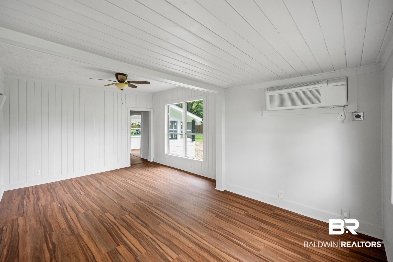 19575 Keller Road Foley, AL 36535 - Photo 3 of 17 Spare room with wood finished floors, wooden ceiling, a ceiling fan, and a wall unit AC