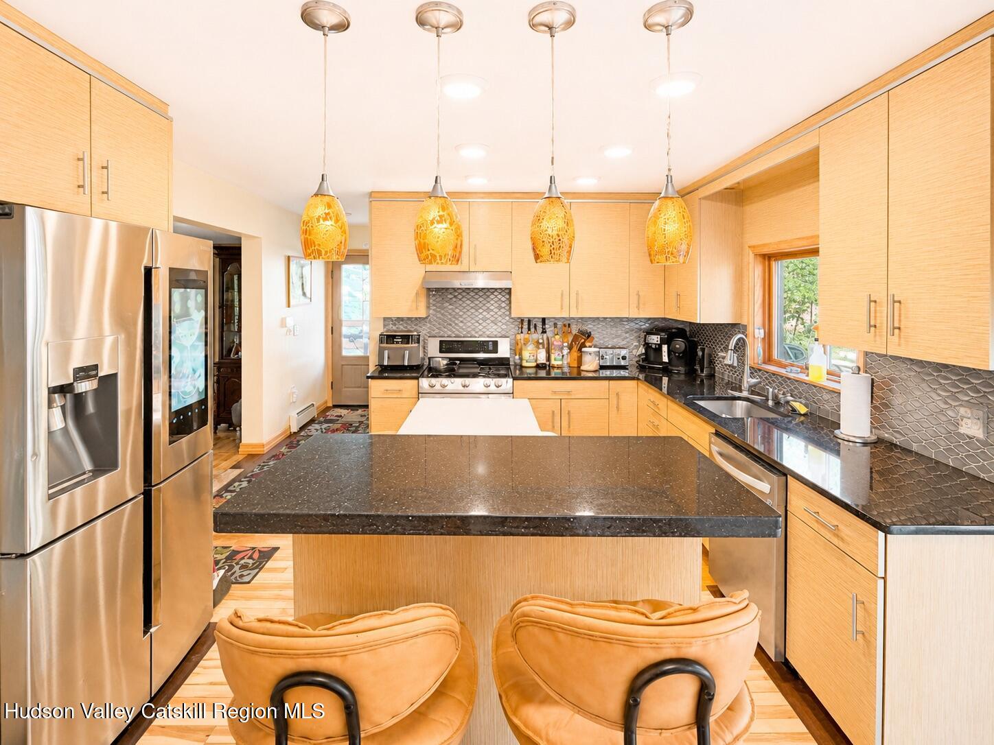 14 Park Road Chichester, NY 12416 - Photo 20 of 20 a kitchen with a granite countertop sink stove and refrigerator