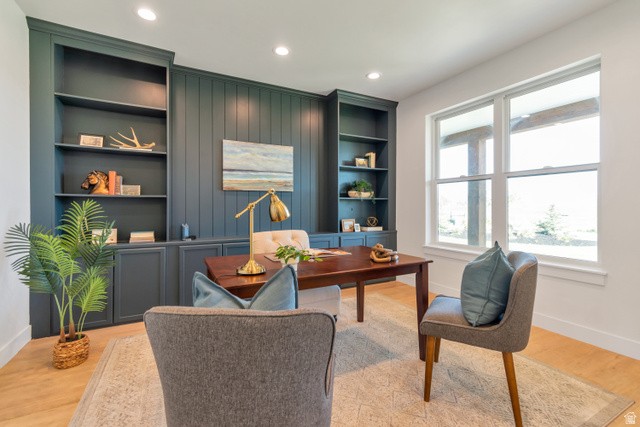1820 West Farmhouse Flats Road Peoa, UT 84061 - Photo 9 of 79 Built-in shelving and cabinetry along a shiplap accent wall, recessed lighting, and light wood-finish flooring