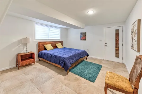 a bedroom with a bed and window