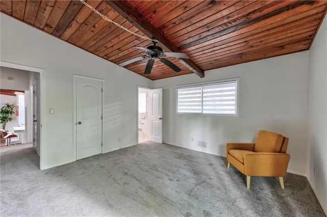 a bathroom with a granite countertop sink and a large mirror