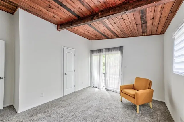 a bathroom with a granite countertop sink and a bathtub