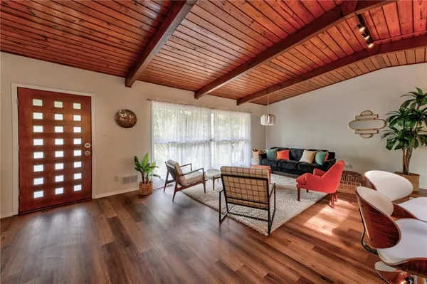a outdoor living space with furniture and wooden floor