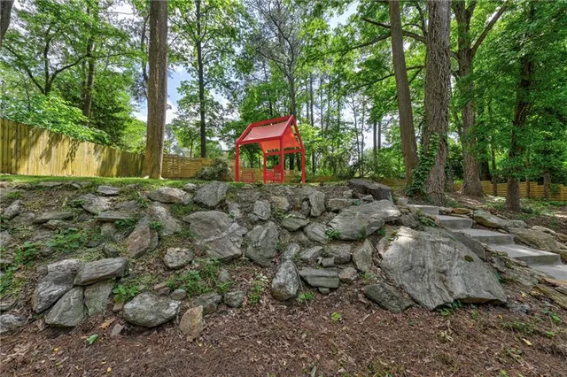 a view of outdoor space with garden and trees