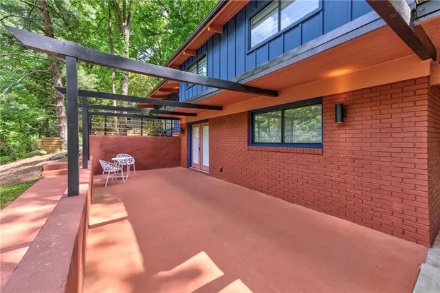 a view of a house with a yard porch and sitting area