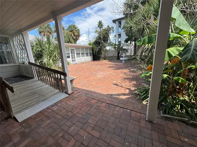 a view of a two chairs in the porch
