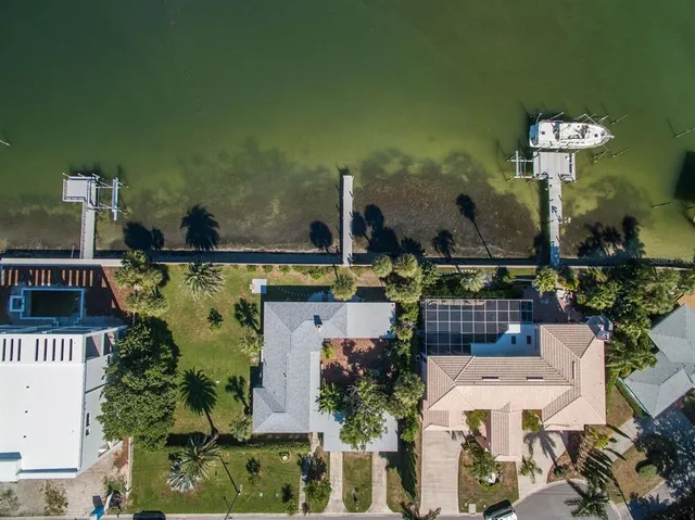 an aerial view of a house with outdoor space