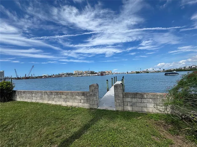 a view of a garden with a building in the background