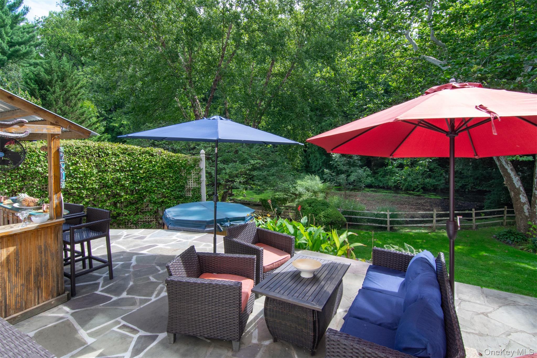 46 Reynal Road White Plains, NY 10605 - Photo 22 of 38 The stone patio provides a peaceful escape surrounded by fresh air and treetop views.