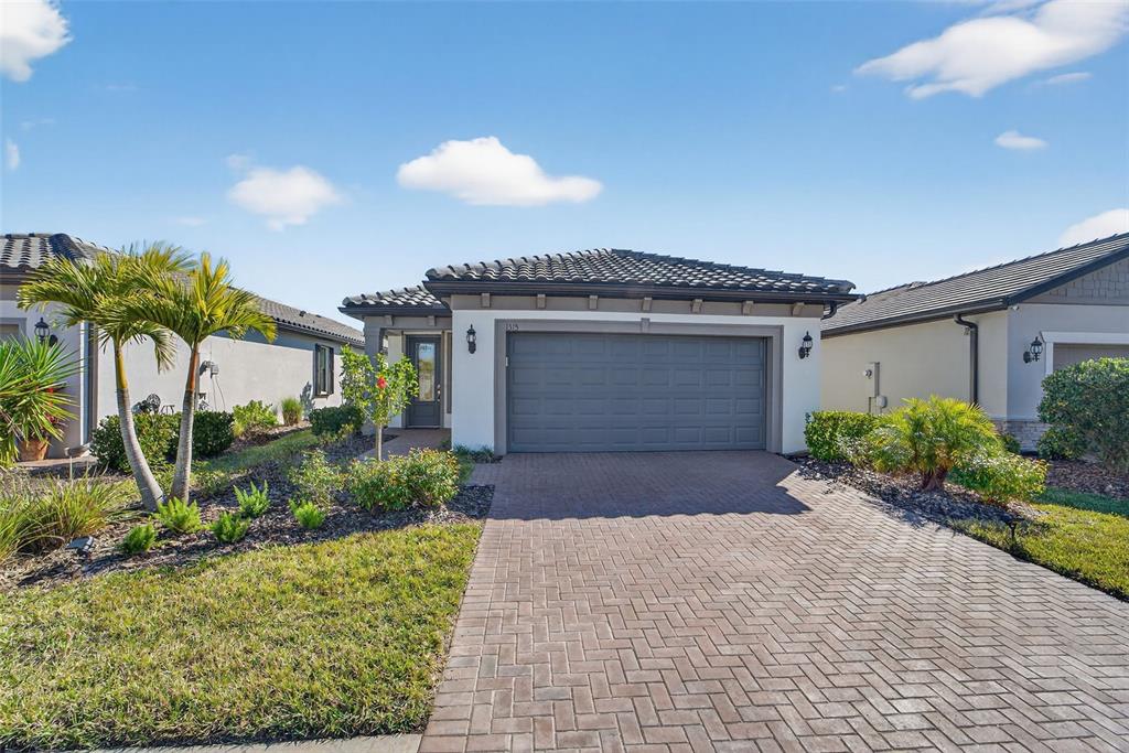 1315 Raspberry Dr Port North Port, FL 34289 - Photo 1 of 1 a front view of a house with garden