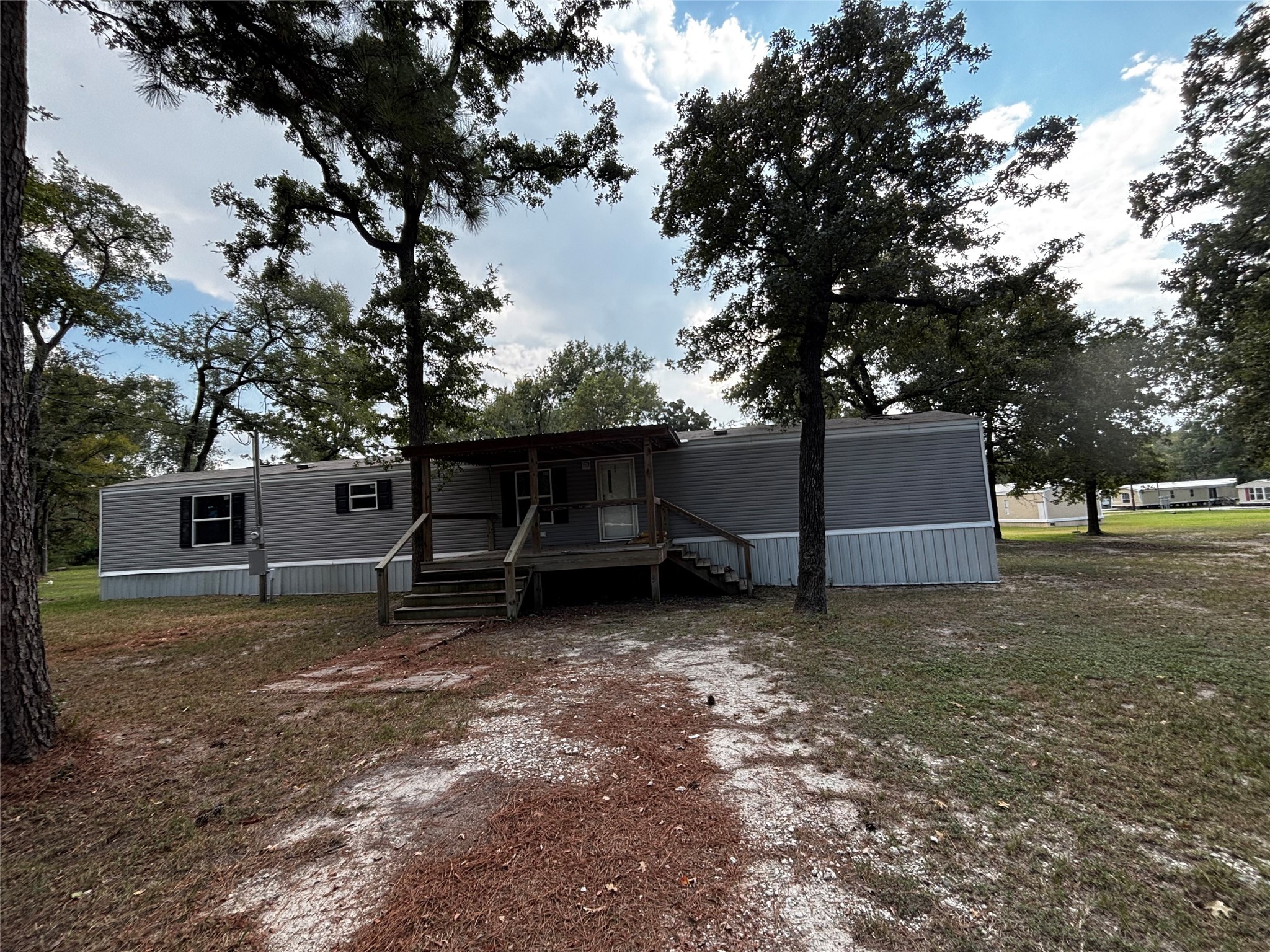 10 South Walnut Lake Drive Huntsville, TX 77320 - Photo 1 of 12 a view of a house with a yard