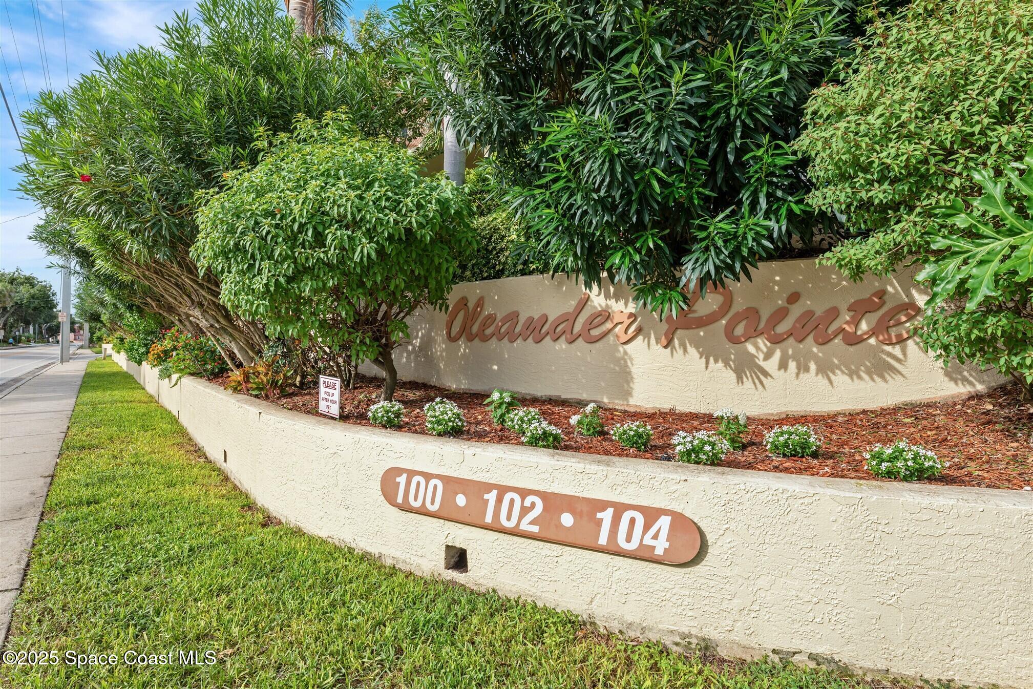 104 Riverside Drive, Unit 402 Cocoa, FL 32922 - Photo 32 of 41 a view of outdoor space with signage and flags