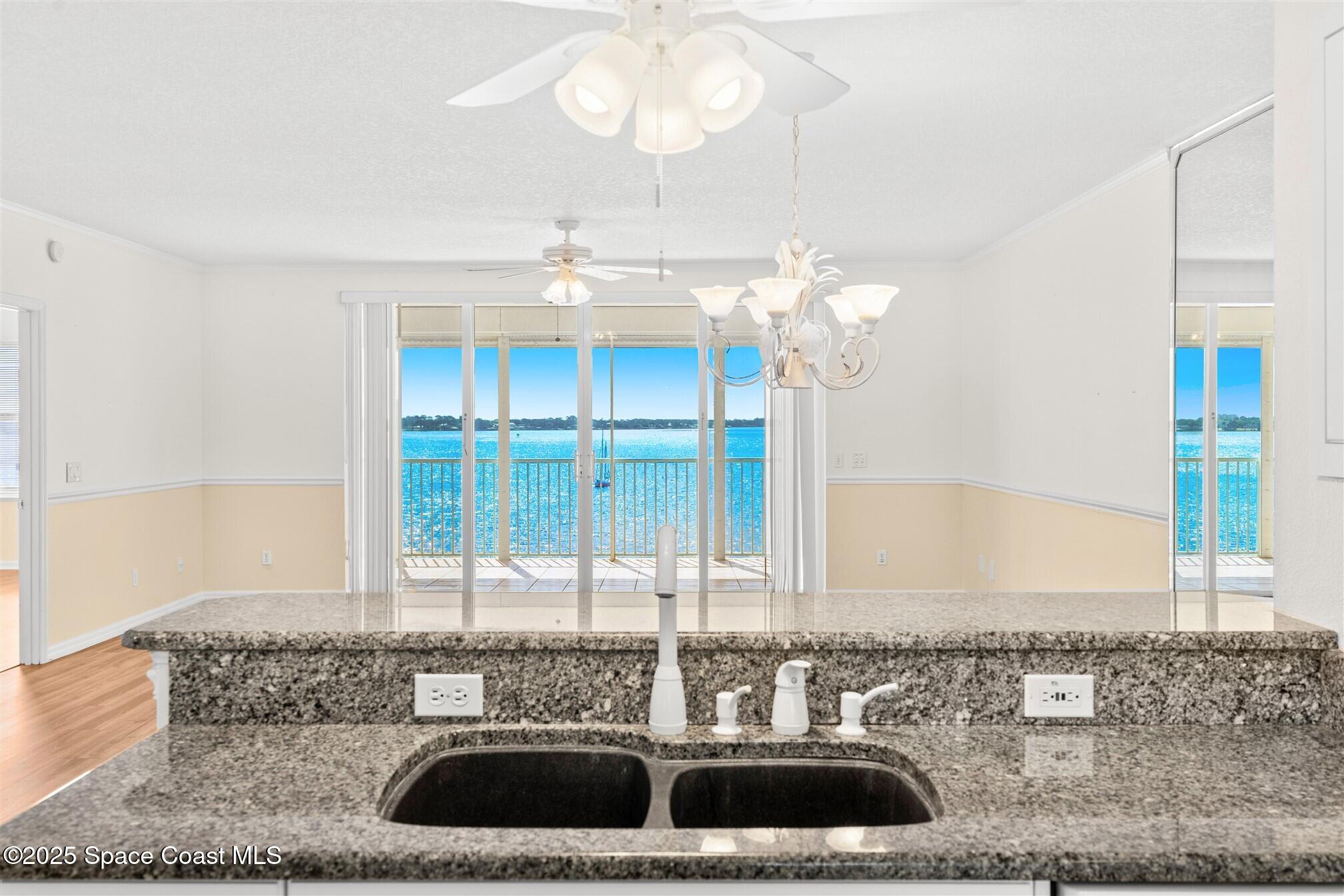 104 Riverside Drive, Unit 402 Cocoa, FL 32922 - Photo 5 of 41 a view of a kitchen with a sink and a window