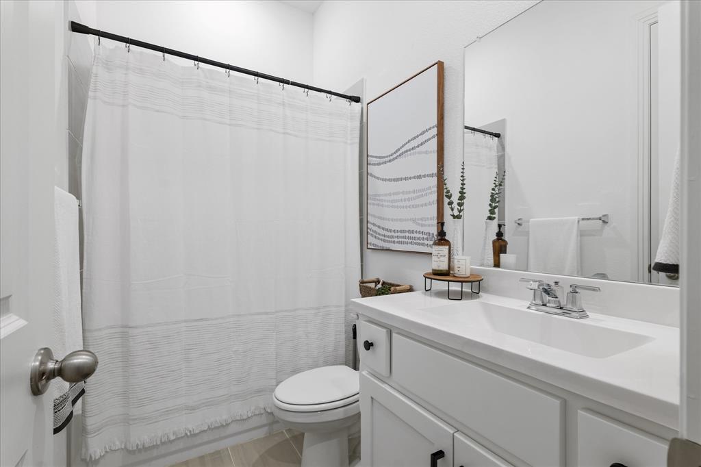 1332 Thompson Road Argyle, TX 76226 - Photo 23 of 36 Full bathroom featuring vanity and curtained shower