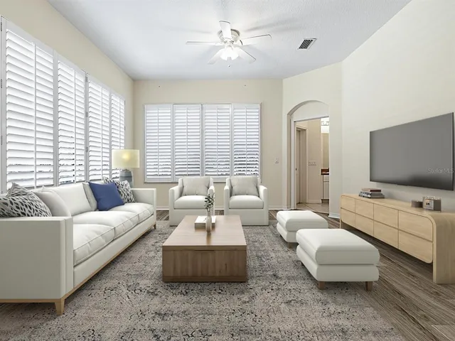 a view of a dining room with furniture and wooden floor