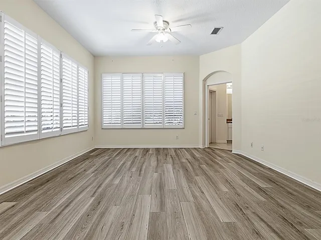 a view of an empty room with a window