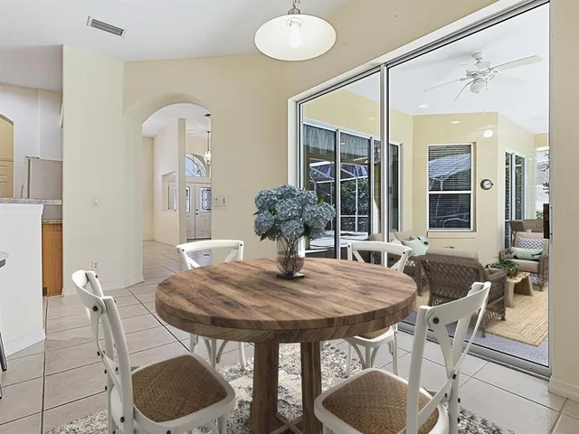 a bathroom with a sink a toilet a mirror and shower