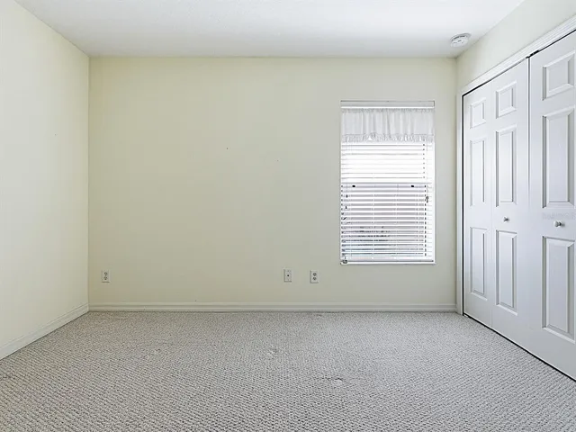 a spacious bathroom with a double vanity sink a mirror and a bathtub