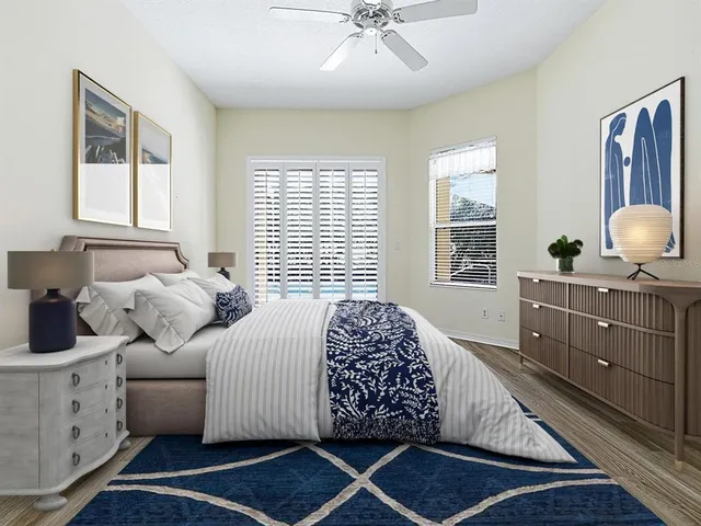 a bathroom with a granite countertop sink a toilet and a mirror