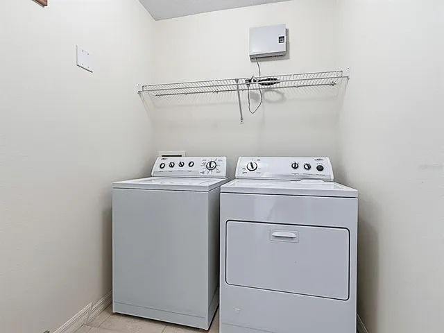 a view of an empty room with glass door