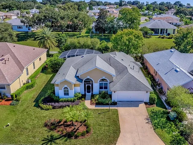 an aerial view of a house with a swimming pool