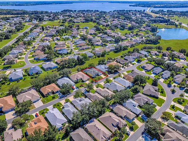 a view of a swimming pool with a yard