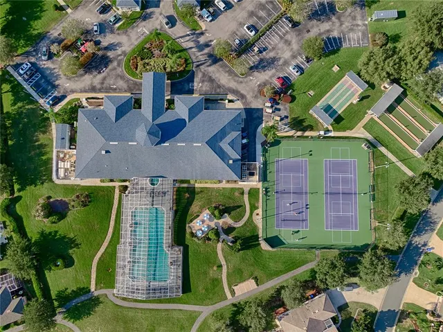 a aerial view of a house with a yard and a garden