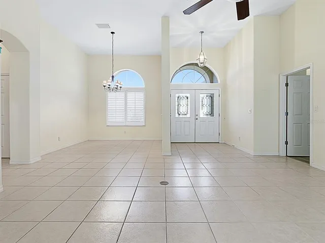 a kitchen with stainless steel appliances granite countertop a stove a refrigerator and a cabinets